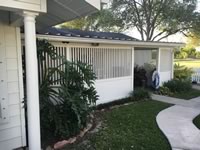 Semi-private vinyl wall around a carport