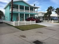 Vinyl concave picket fence and vinyl banister on a coastal home